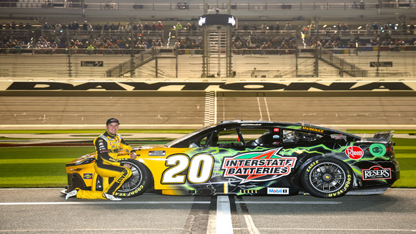 Christopher Bell at the Daytona 500 Qualifying presented by Busch Light, posing with his No. 20 Interstate Batteries Toyota on the starting grid at Daytona International Speedway.