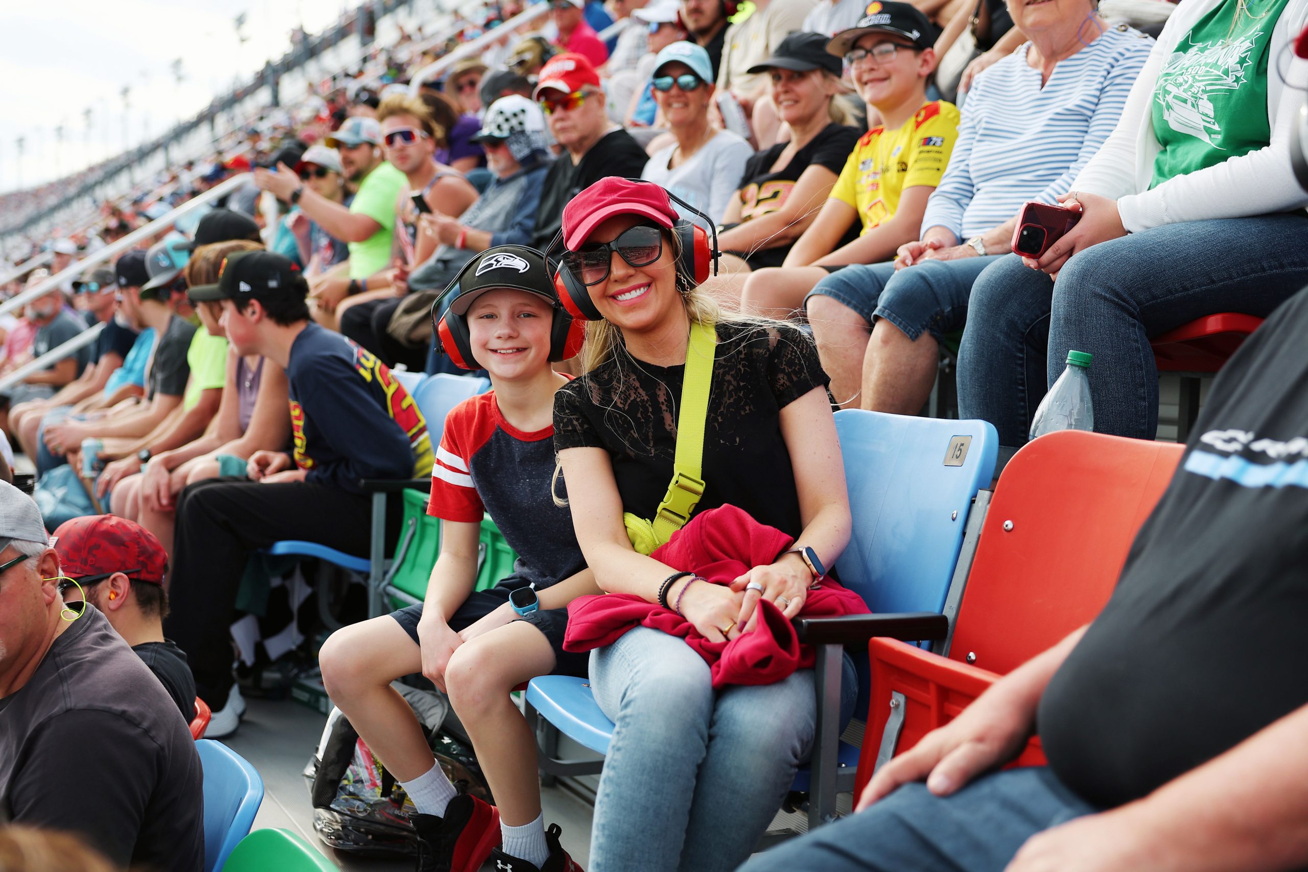 Mom and son enjoying a NASCAR race at Daytona International Speedway